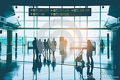 Group of Asian business people, passenger, traveler and group tourist walking in font of gate at Hong Kong International Airport. Editorial Stock Photo