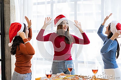 Group of Asian female friends at a party Have a fun time together. pizza party wine drinks Stock Photo