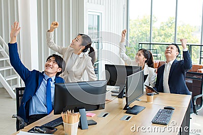 Group Asian professional successful male female businessmen businesswomen employee in formal business suit sitting at working desk Stock Photo