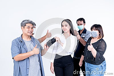 A group of Asians, men and women show signs of inviting use face mask Stock Photo