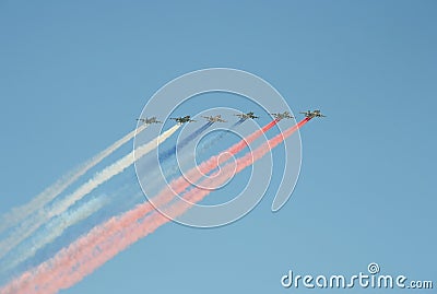 A group of assault plane Sukhoi Su-25 Grach NATO reporting name: `Frogfoot` in the sky smoke colors of Russian flag at the rehea Stock Photo