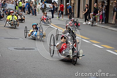 Group of athletes with their special bikes on a city track in a race Editorial Stock Photo