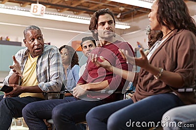 Group Attending Neighborhood Meeting In Community Center Stock Photo