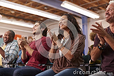 Group Attending Neighborhood Meeting In Community Center Clapping Stock Photo