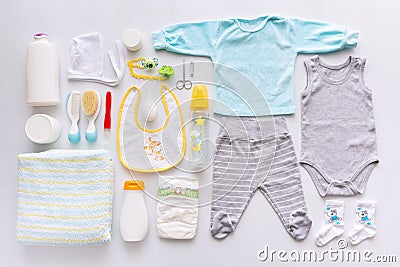 Group of baby boy clothes and equipment. Stock Photo