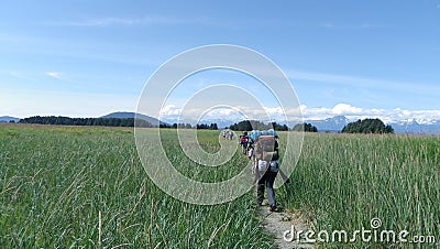 Group backpacking hike meadows mountains 2 Stock Photo