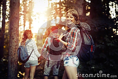 Group of backpacking hikers going for forest trekking Stock Photo