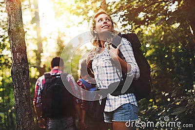 Group of backpacking hikers going for forest trekking Stock Photo