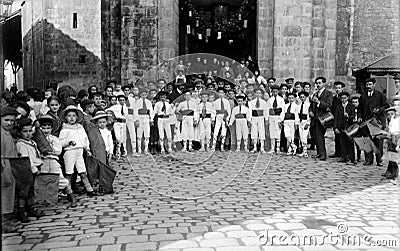 Group of Basque children dancing in front of a church Editorial Stock Photo