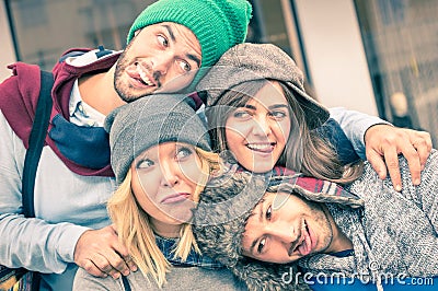 Group of best friends taking selfie outdoors with funny face Stock Photo