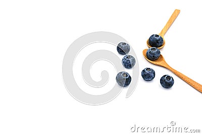 Group of blueburry fresh fruit on two wooden spoon. tropical juicy healthy food. Isolated on white background. copy space for text Stock Photo