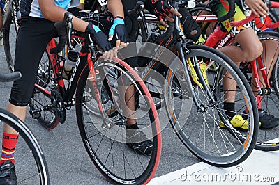 A group of boys dressed in cycling sports along with their bikes Editorial Stock Photo