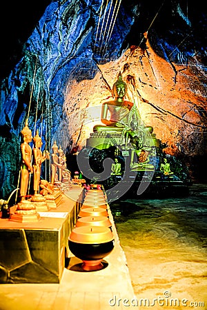 Group of Buddha Image in cave Stock Photo