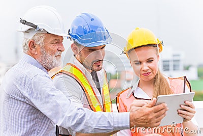 Builder engineer and architecture using new technology of tablet to help their works Stock Photo