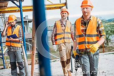 group of builders working together Stock Photo