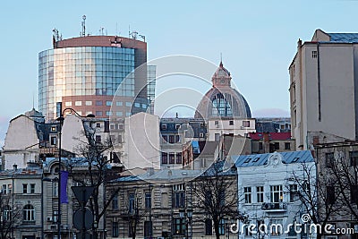 Group of buildings of different ages and architectural styles in Bucharest at twilight Stock Photo