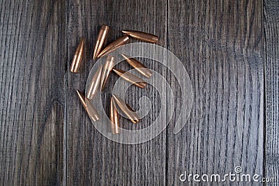 Group of bullets on wooden background Stock Photo