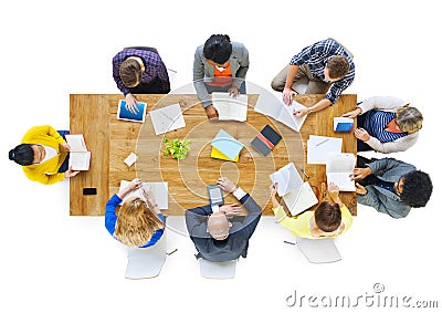 Group of Busienss People Reading Notes on a Meeting Table Stock Photo