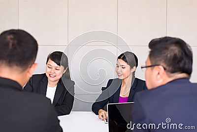Group of business asian people meeting and working communicating while sitting at room office desk together,Teamwork Concept Stock Photo