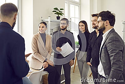 group of business people chatting after a meeting. company employees talking in the office Stock Photo