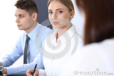Group of business people or lawyers discussing terms of transaction in office. Meeting and teamwork concept Stock Photo