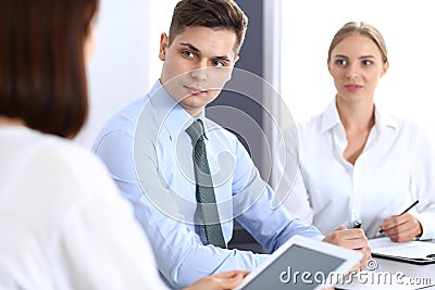 Group of business people or lawyers discussing terms of transaction in office. Meeting and teamwork concept Stock Photo