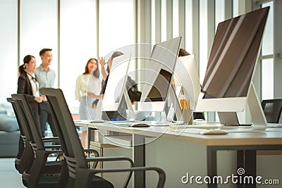 Group of business people meeting together in the modern office.there are many computers on the table. Stock Photo