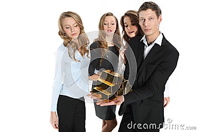Group of business people and the pyramid of gold bars Stock Photo