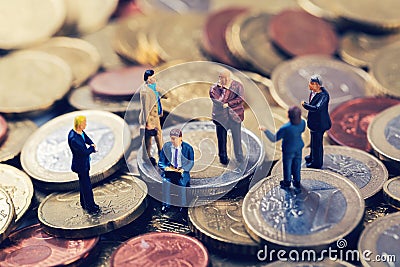 Group of business people standing on euro money stack Stock Photo