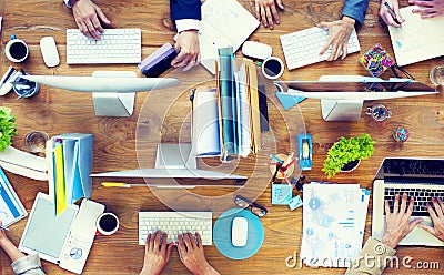 Group of Business People Working on an Office Desk Stock Photo