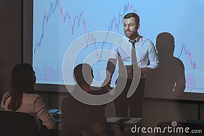 Group of business people working. Technical price graph and indicator, red and blue candlestick chart and stock trading Stock Photo