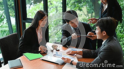 Group of business persons having different age in creative business discussing work. Stock Photo