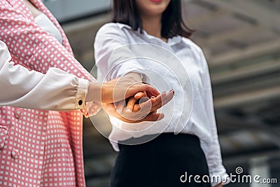 business women, coordinating hands, combining the power of the team Stock Photo