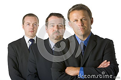 Group Of Businessmen Looking Stern Stock Photo