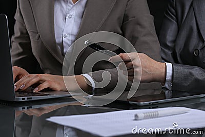 Group of businesspeople or lawyers at meeting. Low key lighting Stock Photo