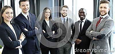 Group of businesspeople standing together in office. Stock Photo