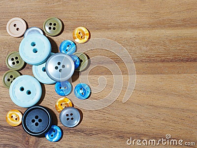 group of button studs on wooden background Stock Photo