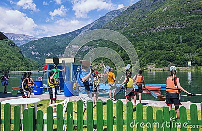 Group of canoes on the lake in the hot summer at children`s summer school Editorial Stock Photo