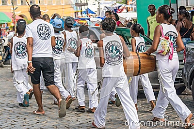 Group of capoeira practitioners walking towards the square Editorial Stock Photo