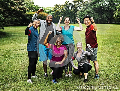Group of cheerful diverse friends in the park Stock Photo