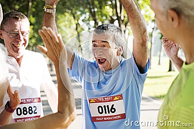 Group of cheerful senior runners at the park Editorial Stock Photo