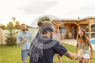 Friends playing blind man`s buff Stock Photo