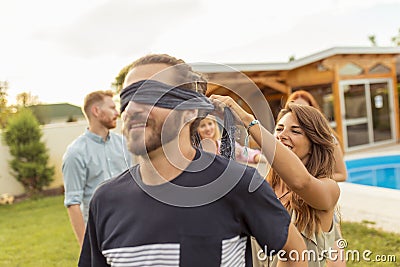 Friends playing blind man`s buff Stock Photo