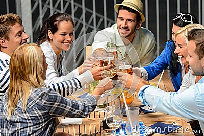 Group of cheerful people toasting with drinks Stock Photo