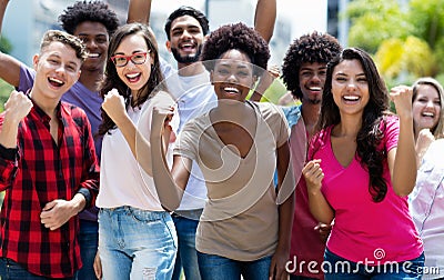 Group of cheering african american and caucasian and hispanic and latin young adults Stock Photo