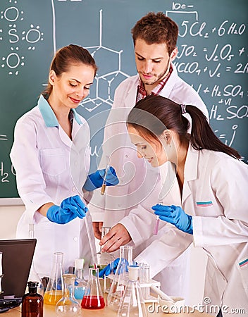 Group chemistry student with flask. Stock Photo
