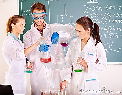 Group chemistry student with flask. Stock Photo