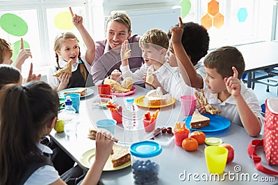 Group Of Children Eating Lunch In School Cafeteria Stock Photo