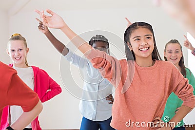 Group Of Children Enjoying Drama Class Together Stock Photo