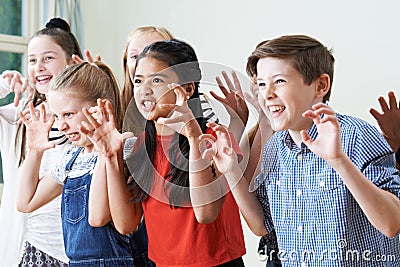 Group Of Children Enjoying Drama Club Together Stock Photo